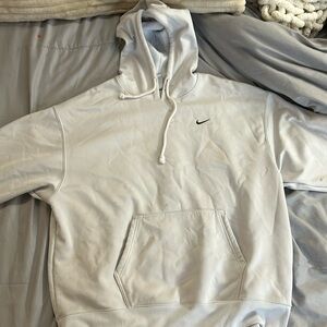 barley worn, a couple stains, has a blue tint from being washed